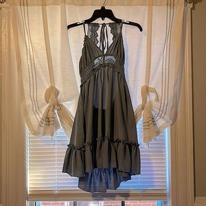 Lucky is the brand, size medium, color is a blue/grey, sleeveless, & backless